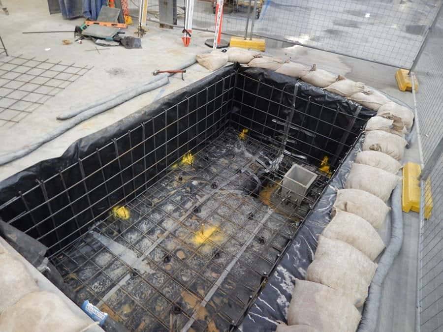 Concrete pit walls and reinforcement