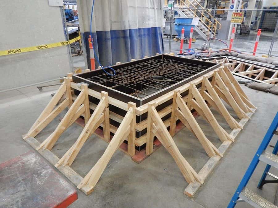 Timber formwork around a concrete pit