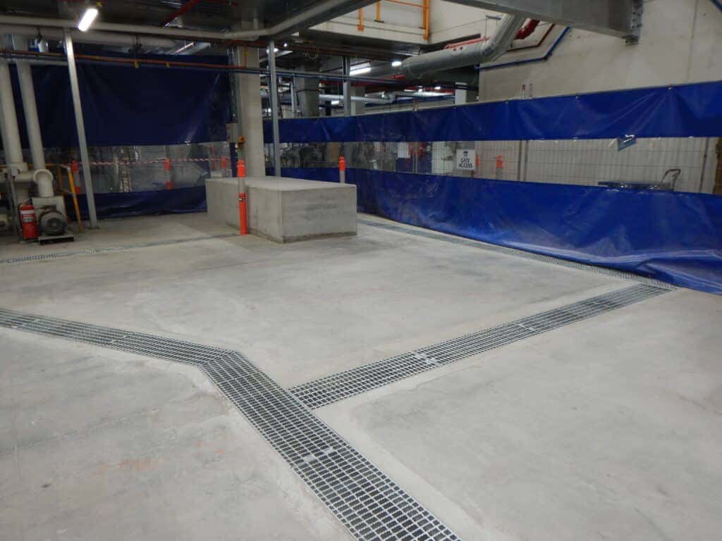 Concrete slab beside an industrial walkway