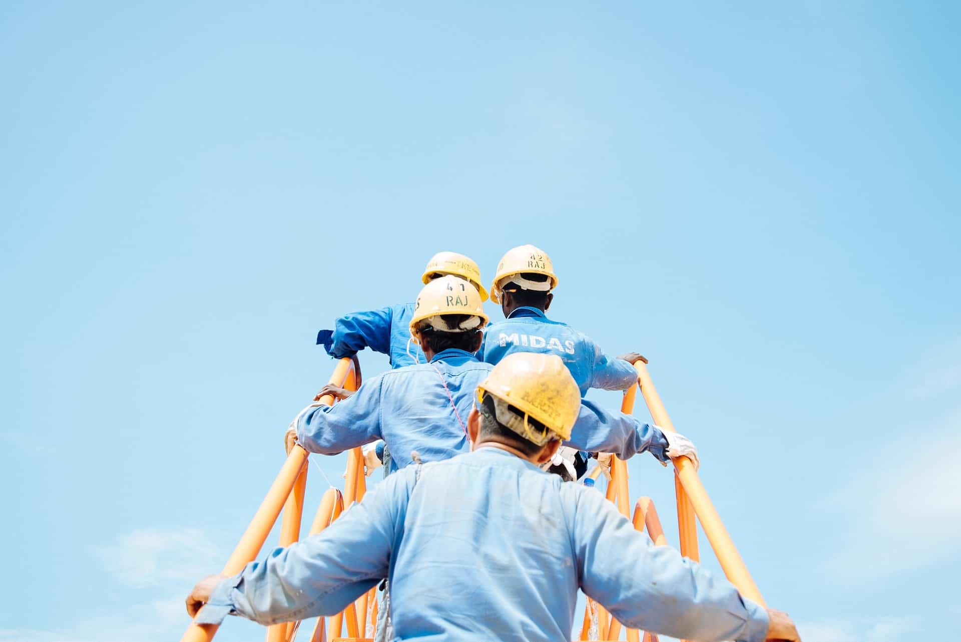 Workers climbing structure