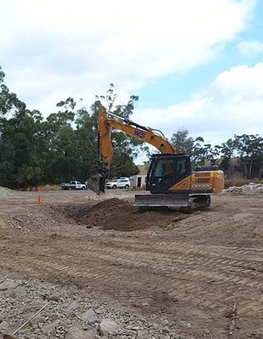 Excavator on a woodland work site