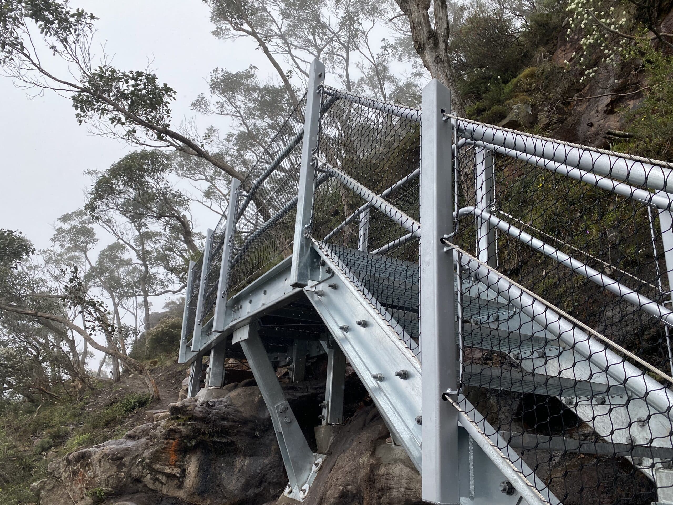 Outdoor metal staircase on cliff